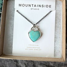Turquoise heart pendant necklace on a card with 'Mountainside Studio' branding in a box.